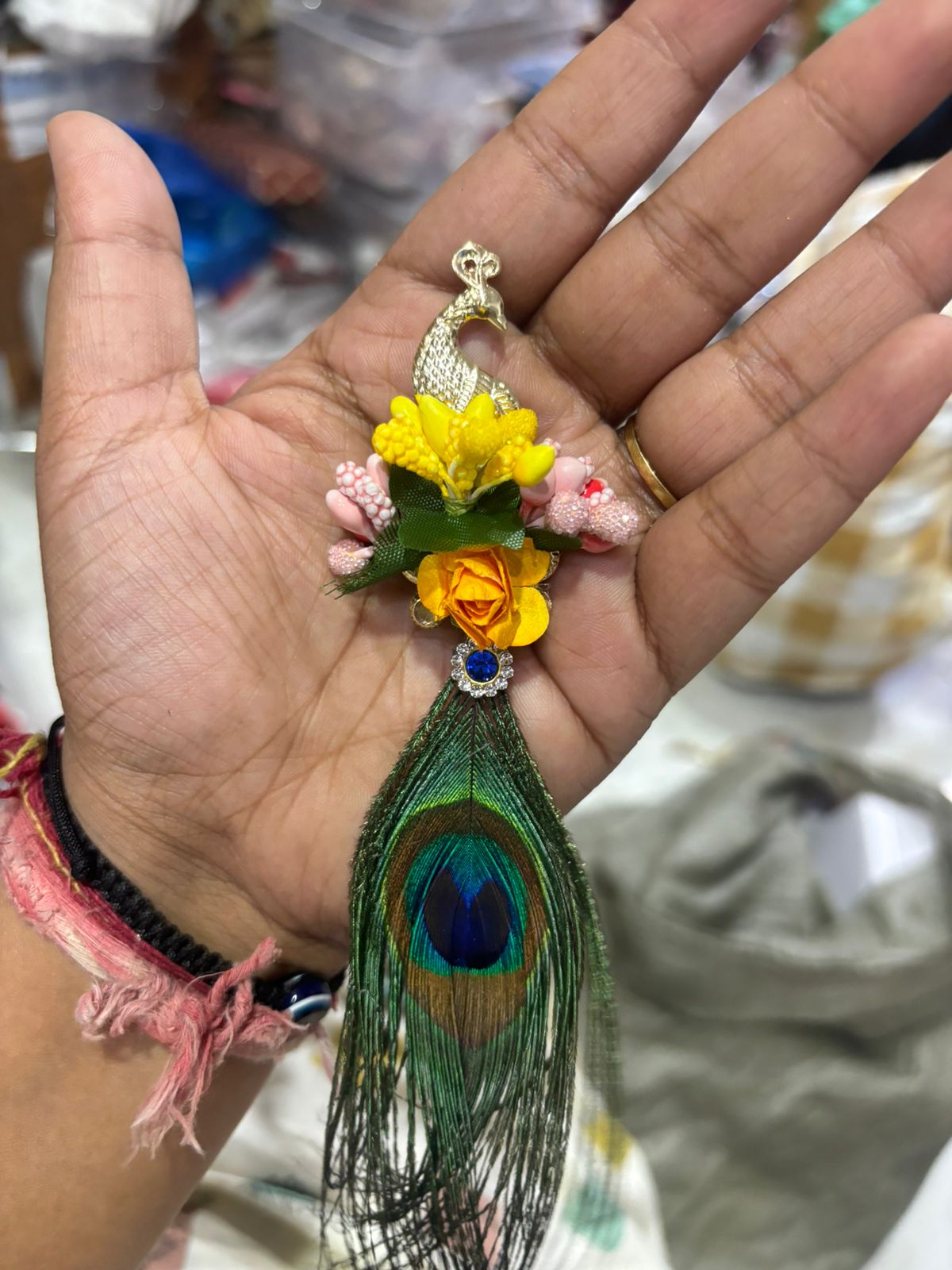 Traditional kundan peacock brooch with floral detailing
