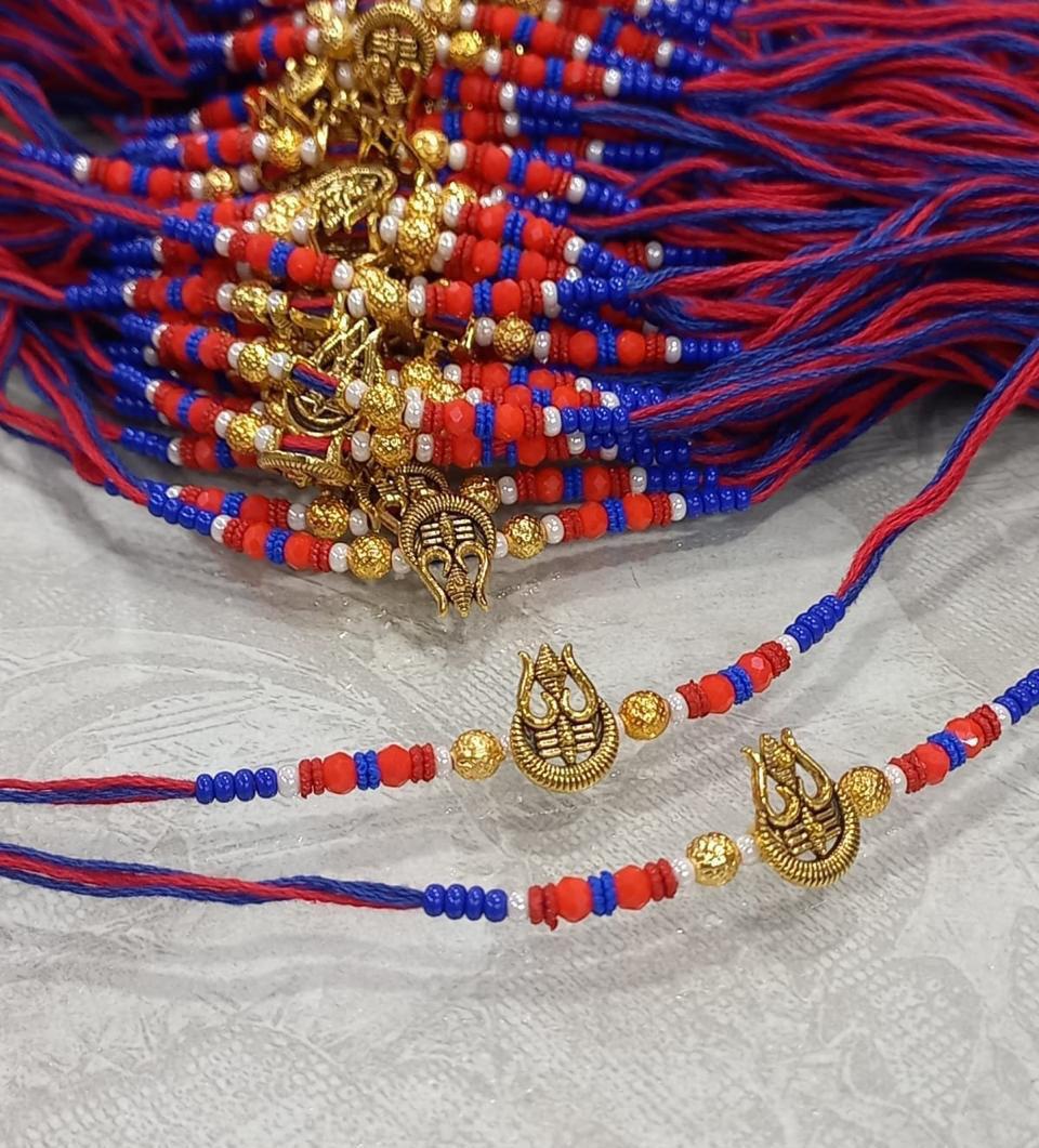 Designer Mahakal Trishul Rakhi with red blue sacred thread for Raksha Bandhan