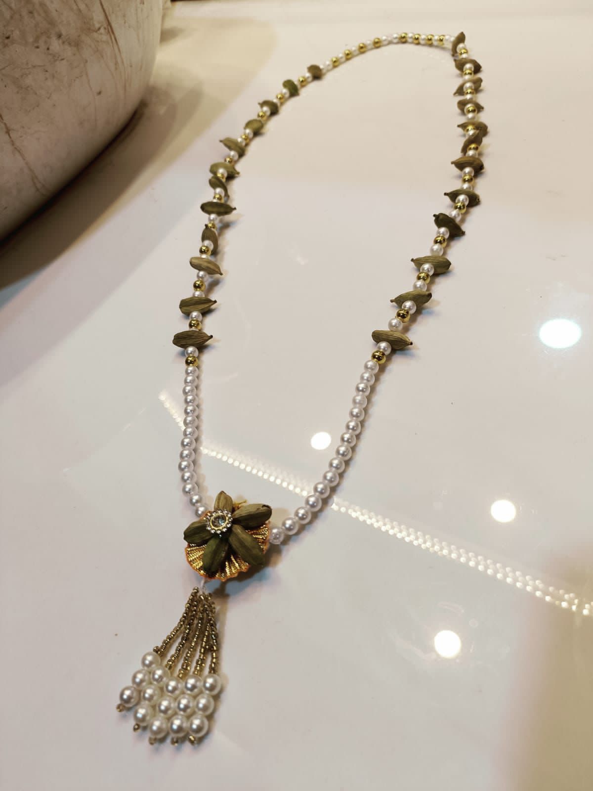 Designer pearl necklace with floral centerpiece for festive occasions