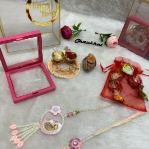 Premium Rakhi Hamper with Transparent Box – Bhaiya Bhabhi Rakhi Set, Roli Chawal, Nariyal, Chocolate & Platter