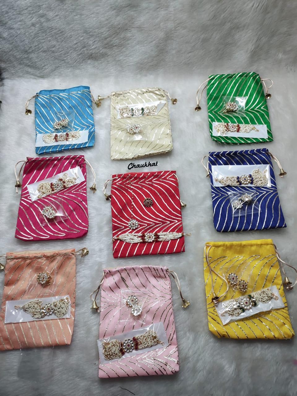 Mini hamper bag with pearl necklace maang tikka and ring jewellery set