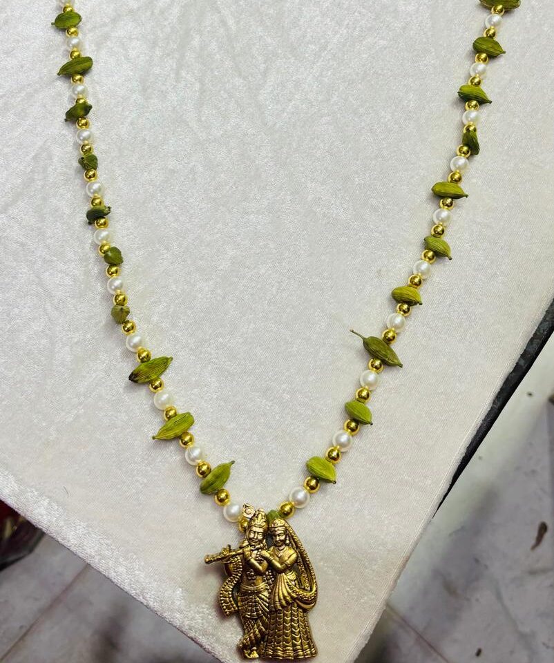 Traditional elaichi welcome mala for groom with Radha Krishna charm