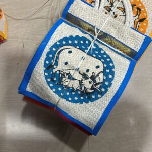 Pichwai theme jute bag with traditional Indian artwork for wedding and festive gifting
