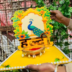 Designer bridal haldi platter with artistic peacock background for wedding ceremony