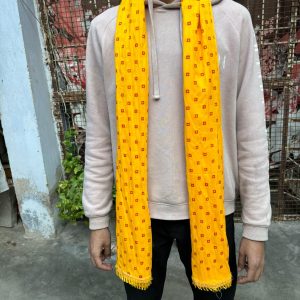 Traditional yellow bandhej phatka used for wedding welcome and haldi ceremony