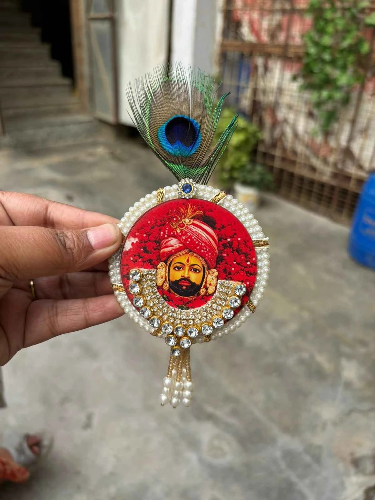 Traditional kundan brooch inspired by Shyam Baba morpankh style