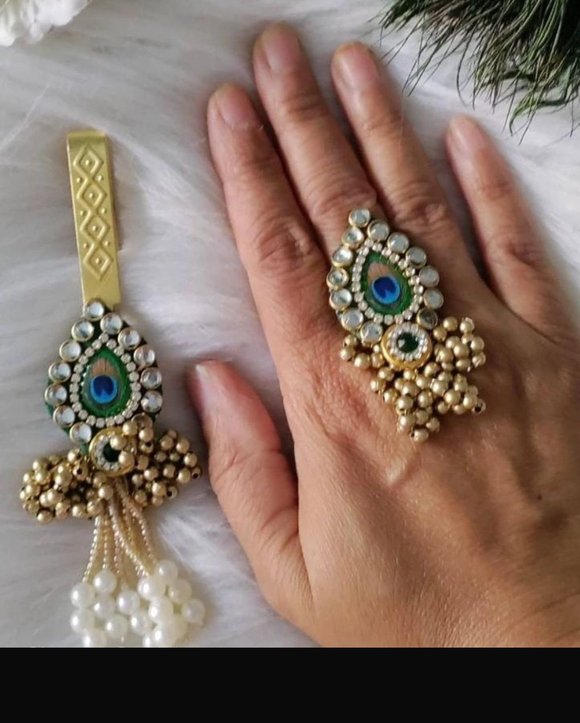 Peacock feather style satka with matching ring for festive return gift