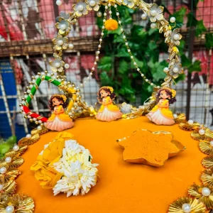 Designer haldi ceremony thali with floral ring and dolls