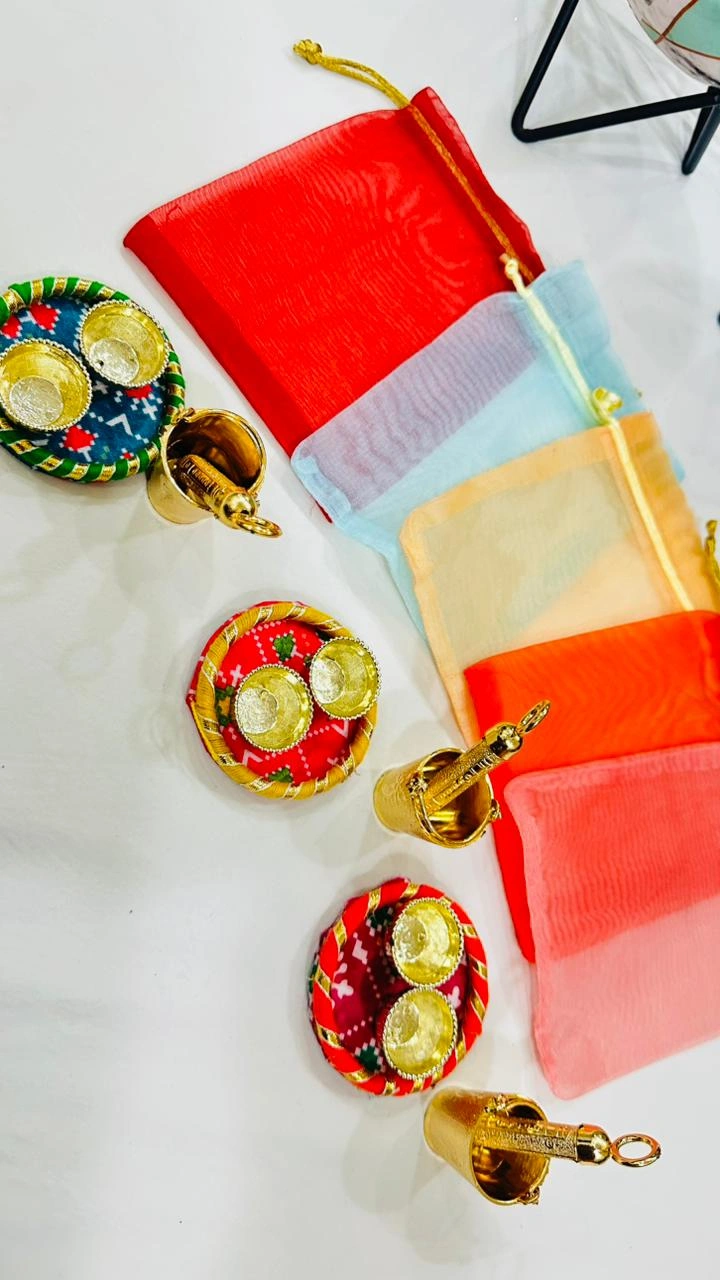 Balti pichkari roli chawal plate in potli for Holi celebration