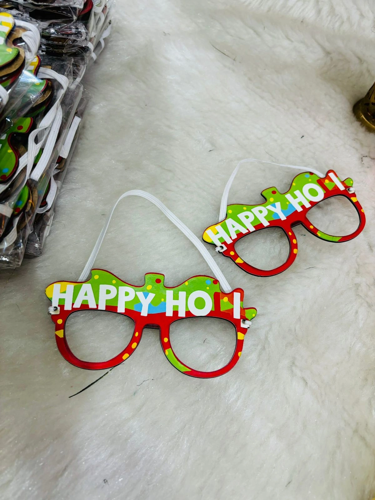 Kids wearing colorful Holi sunglasses with white kurta covered in gulal