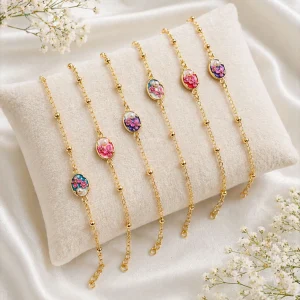 floral oval designer rakhi with golden finish