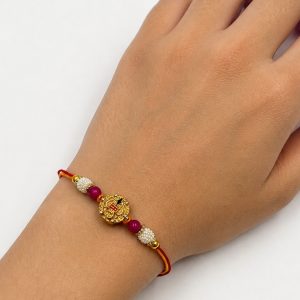 traditional gold rakhi with pearl work for brother raksha bandhan designer rakhi