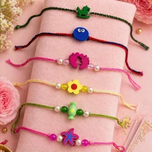 Cute kids rakhi with colorful cartoon and floral charms for Raksha Bandhan celebration