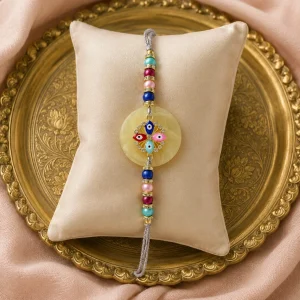 Colorful Evil Eye Rakhi with pearl beads and crystal design for Raksha Bandhan celebration