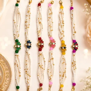 Premium Lotus Lumba Rakhi Bracelet with pearl beads in multicolor designer finish for Bhabhi during Raksha Bandhan.