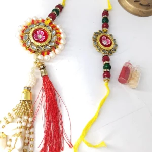 Designer Bhaiya Bhabhi Rakhi Set with Lumba Rakhi featuring Pearl, Kundan and Cowrie Shell design including Roli Chawal for Raksha Bandhan.