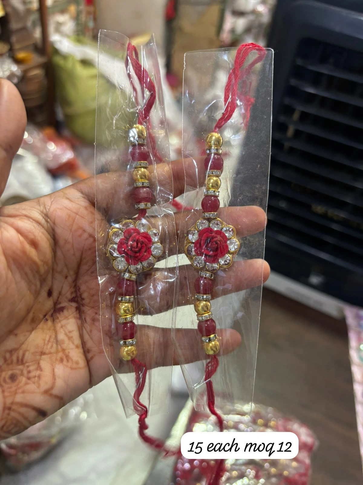 Premium Rose Designer Rakhi with elegant floral centerpiece and traditional thread for Raksha Bandhan celebration