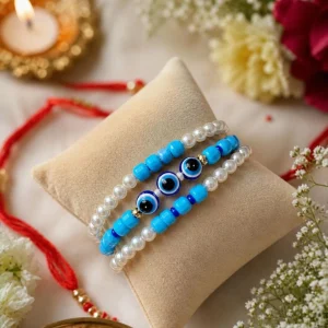 Premium handmade blue evil eye rakhi with pearl beads for brother, designer nazar protection Raksha Bandhan rakhi.