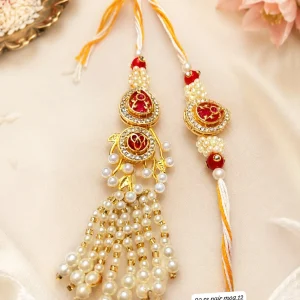 Designer Bhai Bhabhi Rakhi Set featuring an elegant pearl Lumba with premium handcrafted Rakhi for Raksha Bandhan gifting.