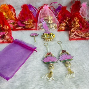 Shubh Labh and chopra with tilak stick set in potli bag for festival return giftsa