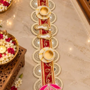 Handcrafted beaded lotus flower tealight holder table runner laid on a wooden dining table