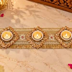 Handmade gold table runner decorated with beads and built-in tea light candle holders for home and dining table decoration